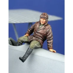 Figurine Pilote De La 1ère GM Assis Sur L'avion (sur L'aile Ou Le Fuselage)